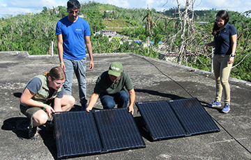 team installing solar panels
