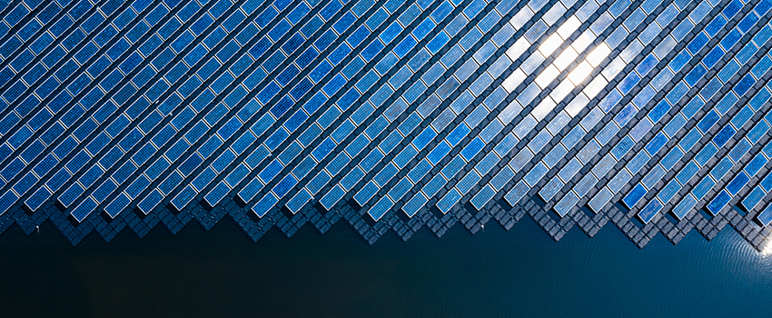 solar panels floating on body of water