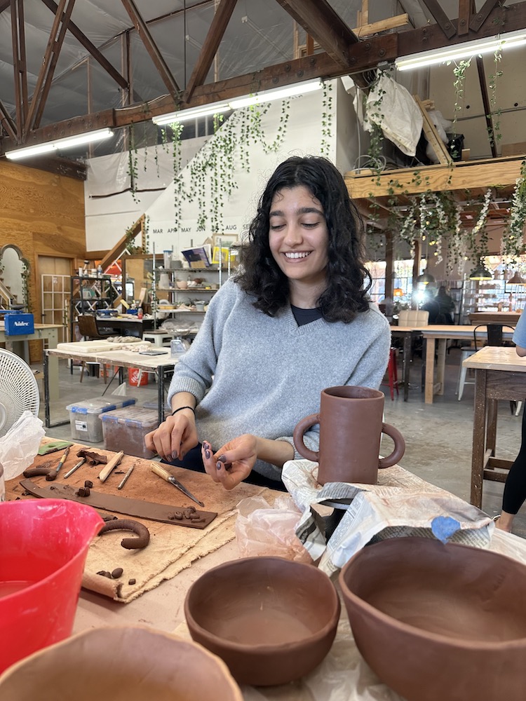 Sarina in pottery class