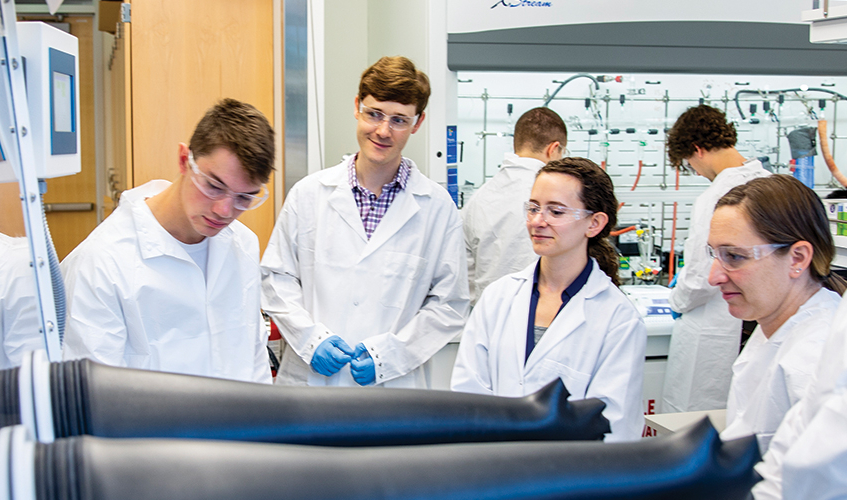 vincent holmberg in lab with students