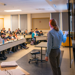 professor giving lecture in classroom