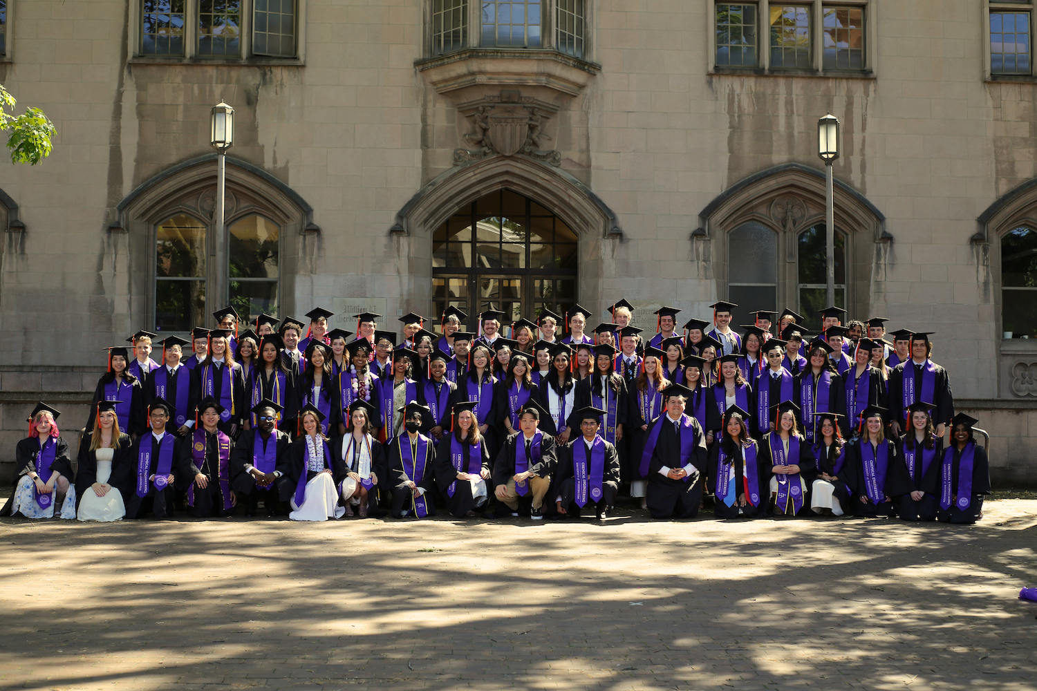 The undergraduate class of 2026 in their graduation cap and gown lined up in front of Gerberding Hall on UW Seattle campus. 