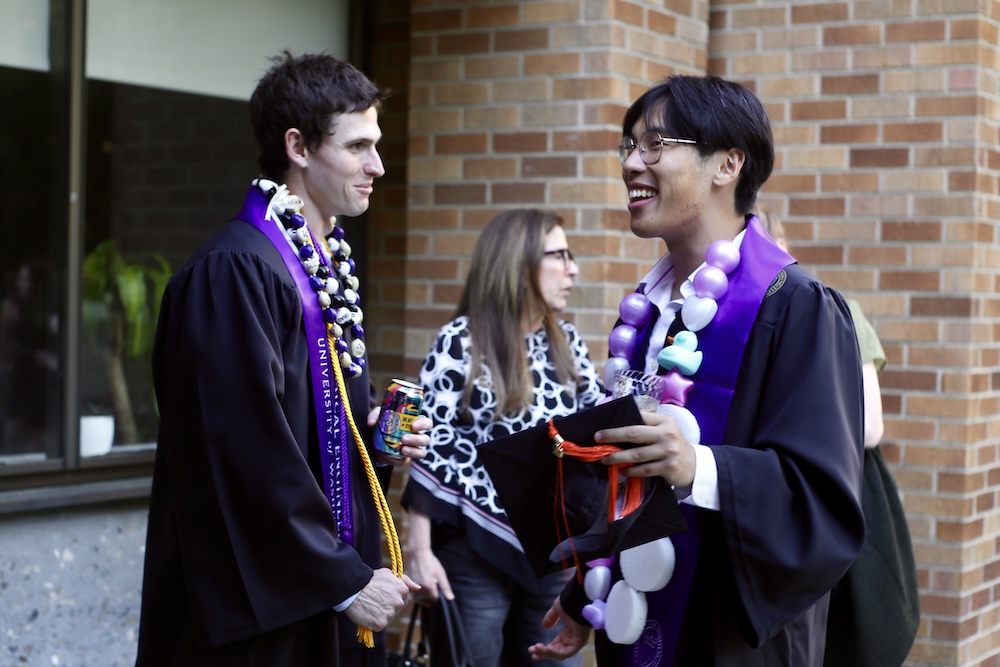 Recent graduates talk at the commencement reception. 