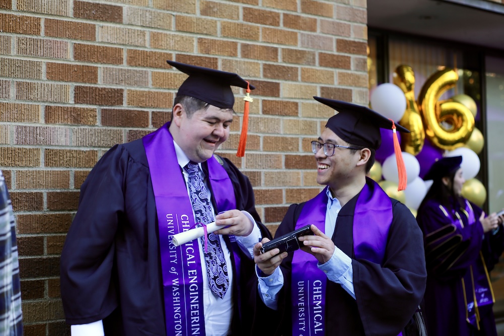Recent graduates talk at the commencement reception.