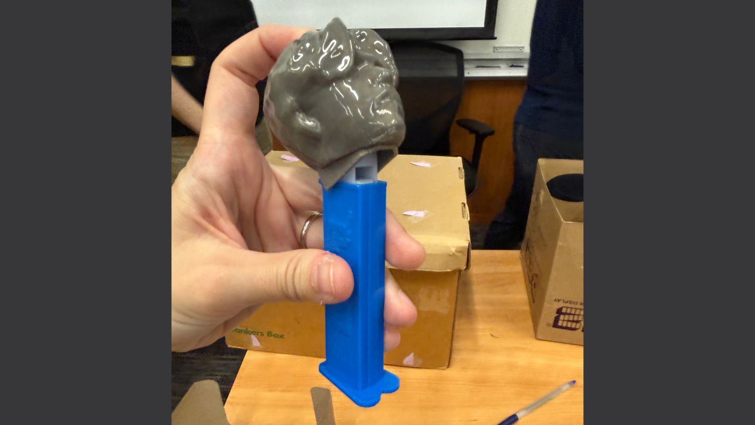 A mock-up of the functional PEZ dispenser with a custom student head.
