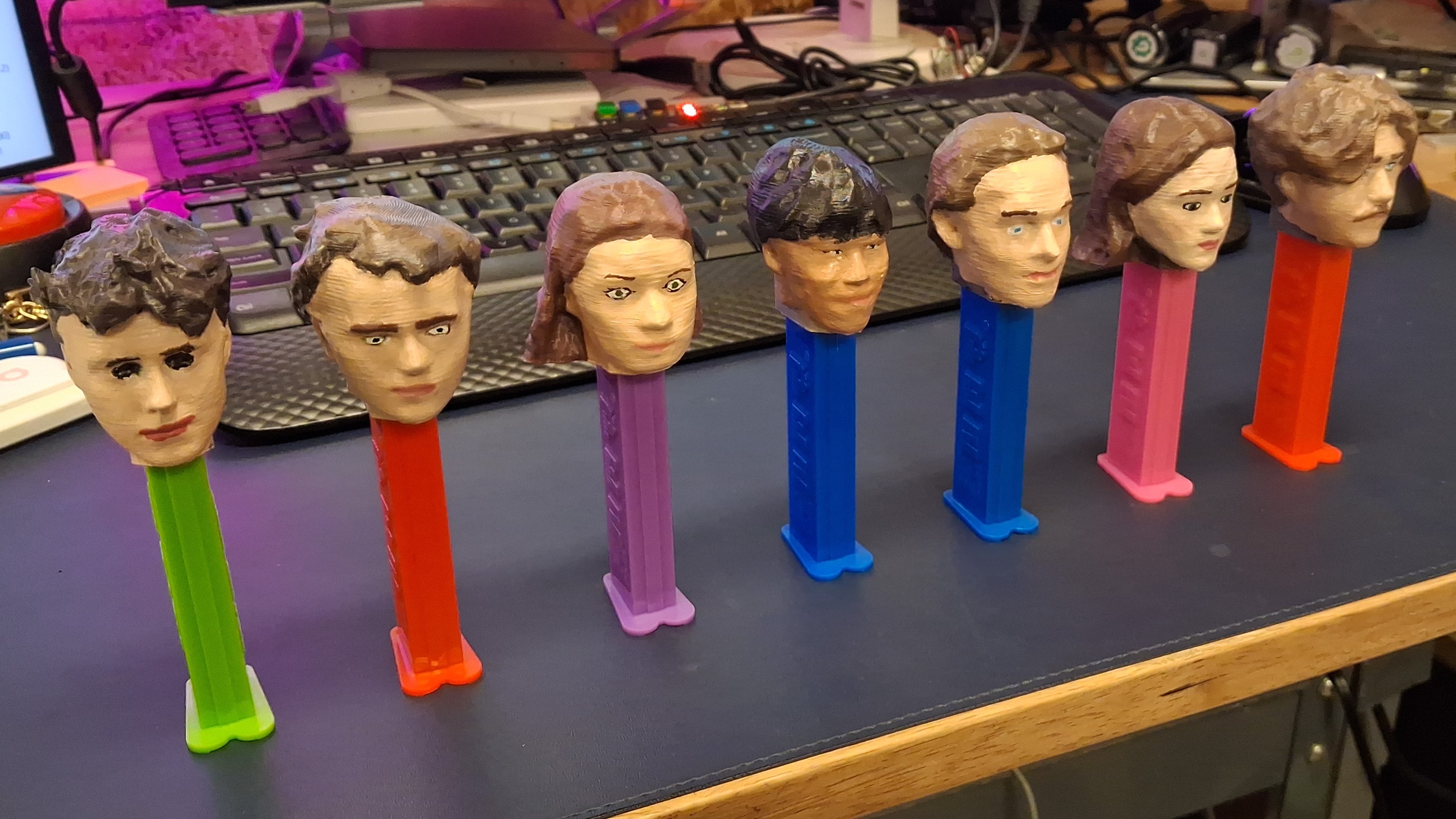 All of the finished PEZ dispensers lined up in a row. 