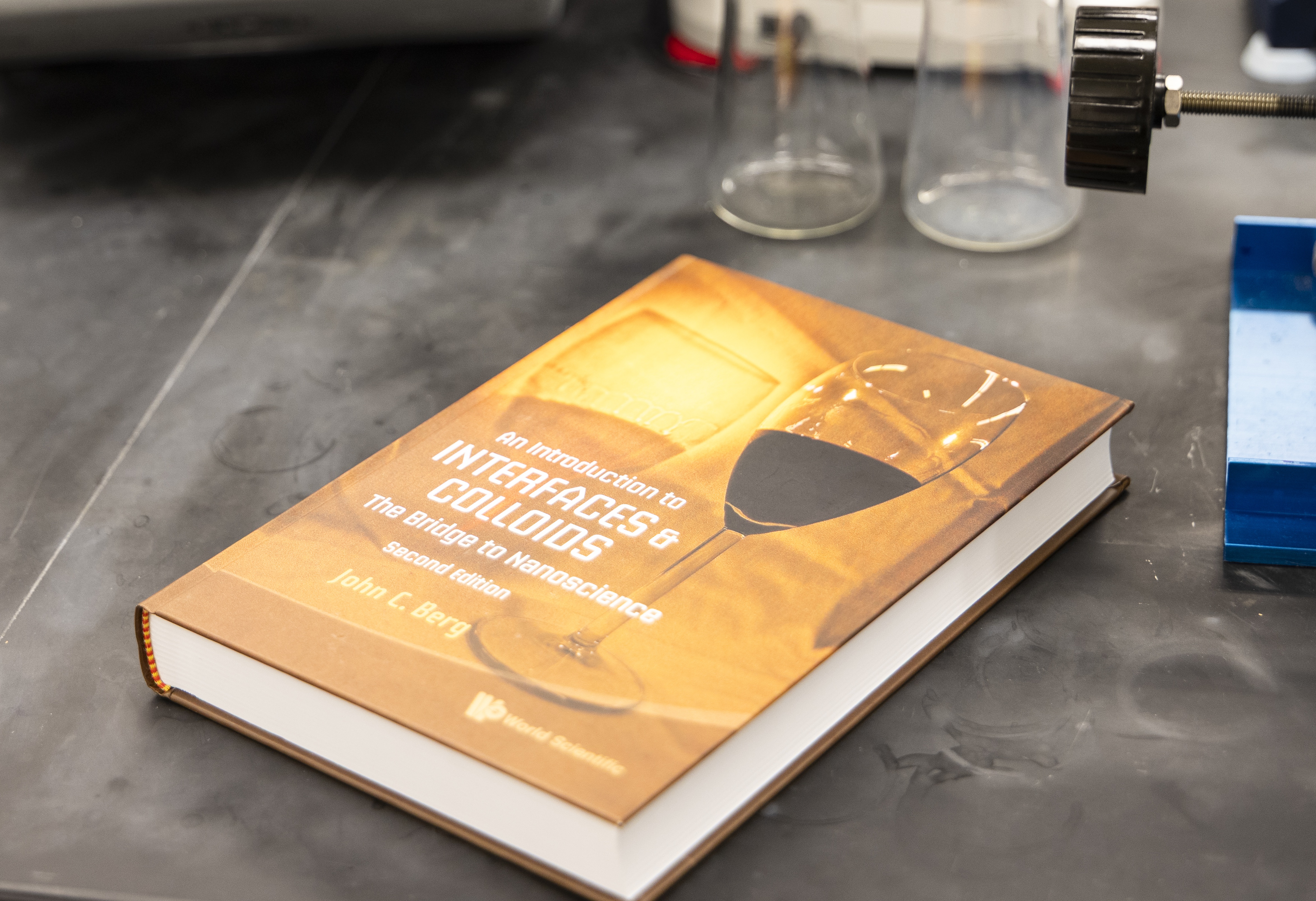 A textbook laying on a lab table.