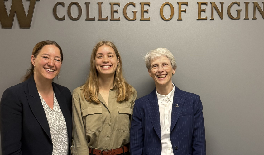 Elizabeth Nance, Sofia Dahlgren and Nancy Allbritton stand in front of a wall that says "College of Engineering." 