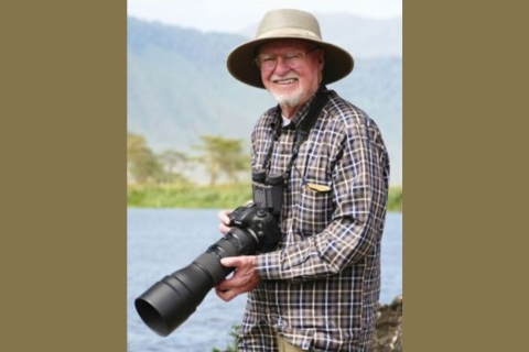 Charles Sleicher holding his camera