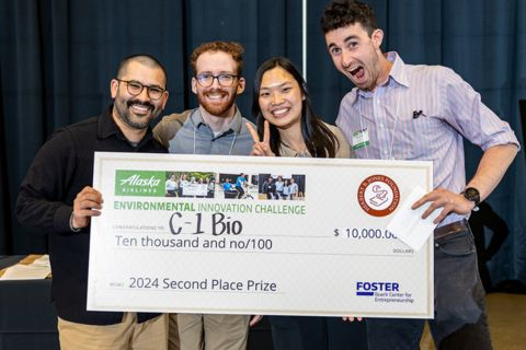 C1bio team poses with check award