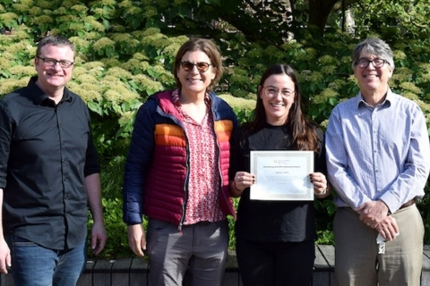 Maria Politi receives her certificate, along with ChemE professors Lilo Pozzo and Dan Schwartz