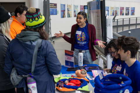 ChemE student Sydney Floryanzia speaks to a group of people at a STEM event