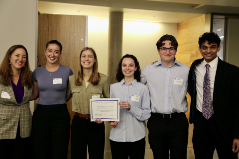 Team members from Lockheed Martin Corporation capstone team hold their certificate while standing with Dept. Chair Elizabeth Nance.