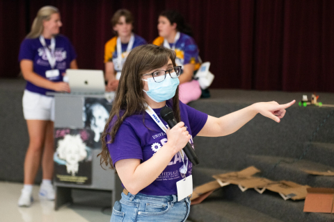 Alex Prybutok points as she directs a group of students during UW STEM Camp.