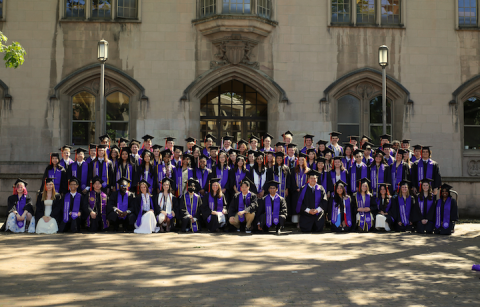 The undergraduate Class of 2026 stands outside Gerberding Hall before commencement. 