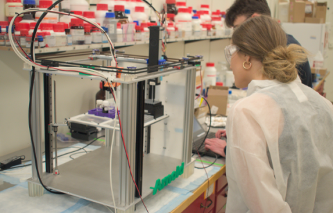 Students use pipetting robots in the Pozzo lab. 